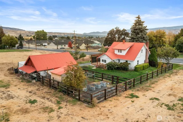 a view of a chairs and table in the patio