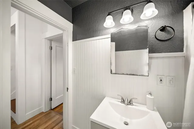 a bathroom with a sink and a mirror