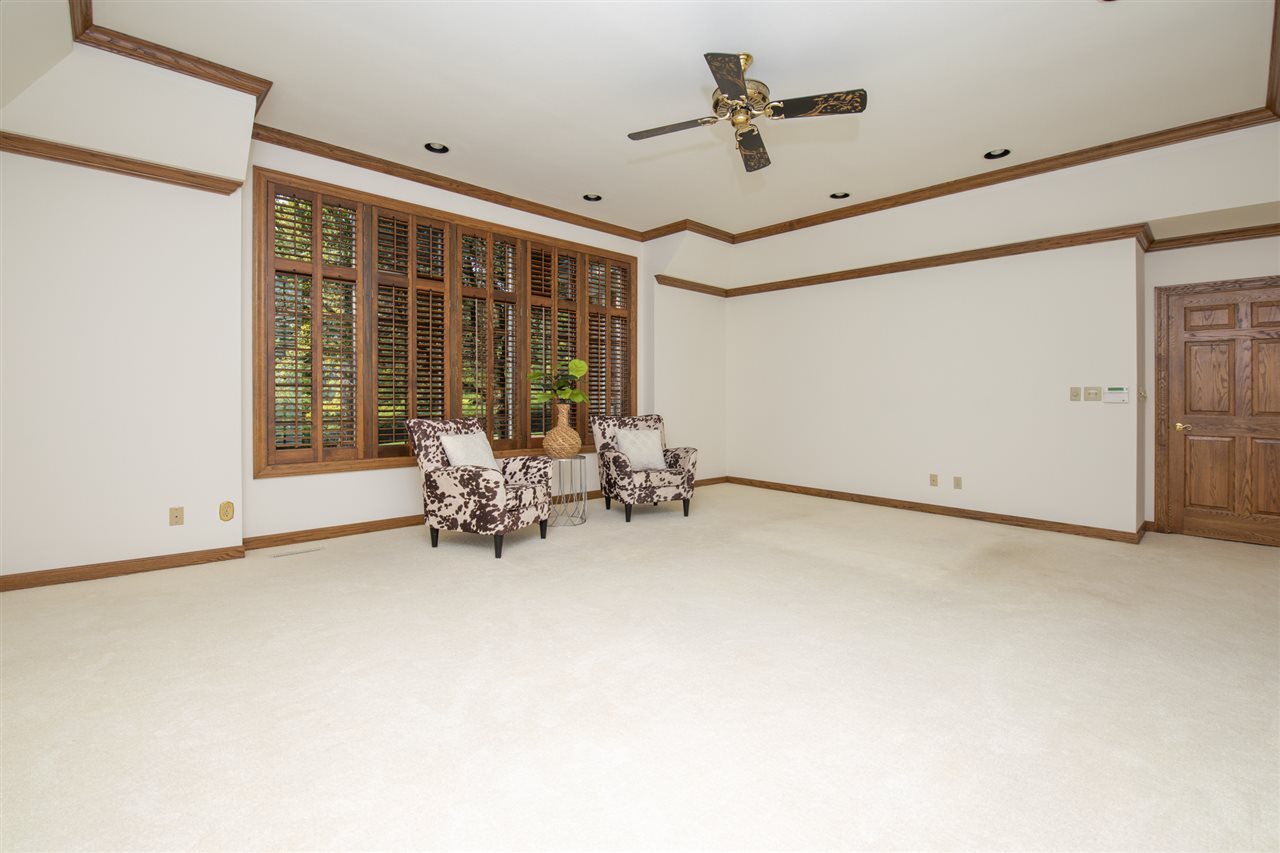 1734 Riverside Road Belvidere, IL 61008 - Photo 18 of 40 a view of room with furniture and a ceiling fan