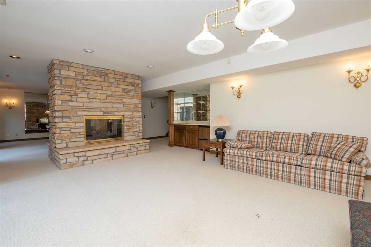 1734 Riverside Road Belvidere, IL 61008 - Photo 27 of 40 a view of livingroom with furniture and fireplace