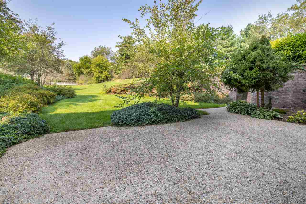 1734 Riverside Road Belvidere, IL 61008 - Photo 31 of 40 a view of a yard with plants and large trees