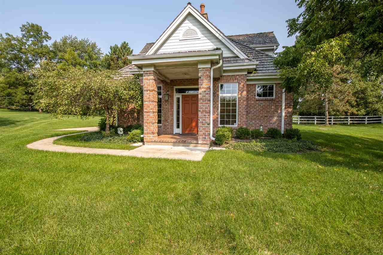 1734 Riverside Road Belvidere, IL 61008 - Photo 32 of 40 a view of a house with garden and trees