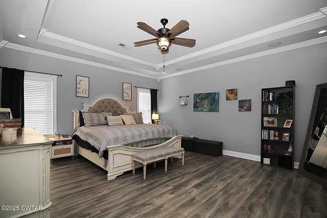 a bedroom with a bed and a book shelf