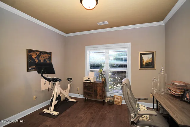 a view of a chairs and table in the back yard of the house
