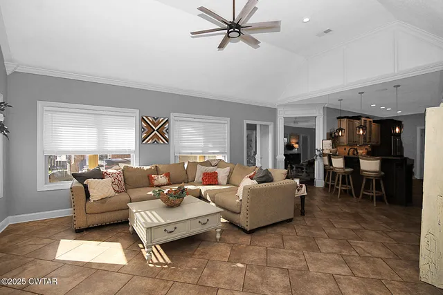 a living room with furniture and a window