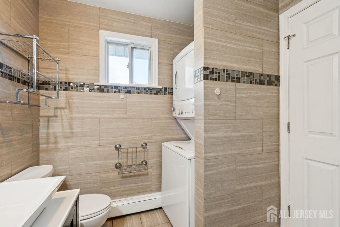 25 Reed Street Edison, NJ 08817 - Photo 13 of 23 a bathroom with a toilet and shower