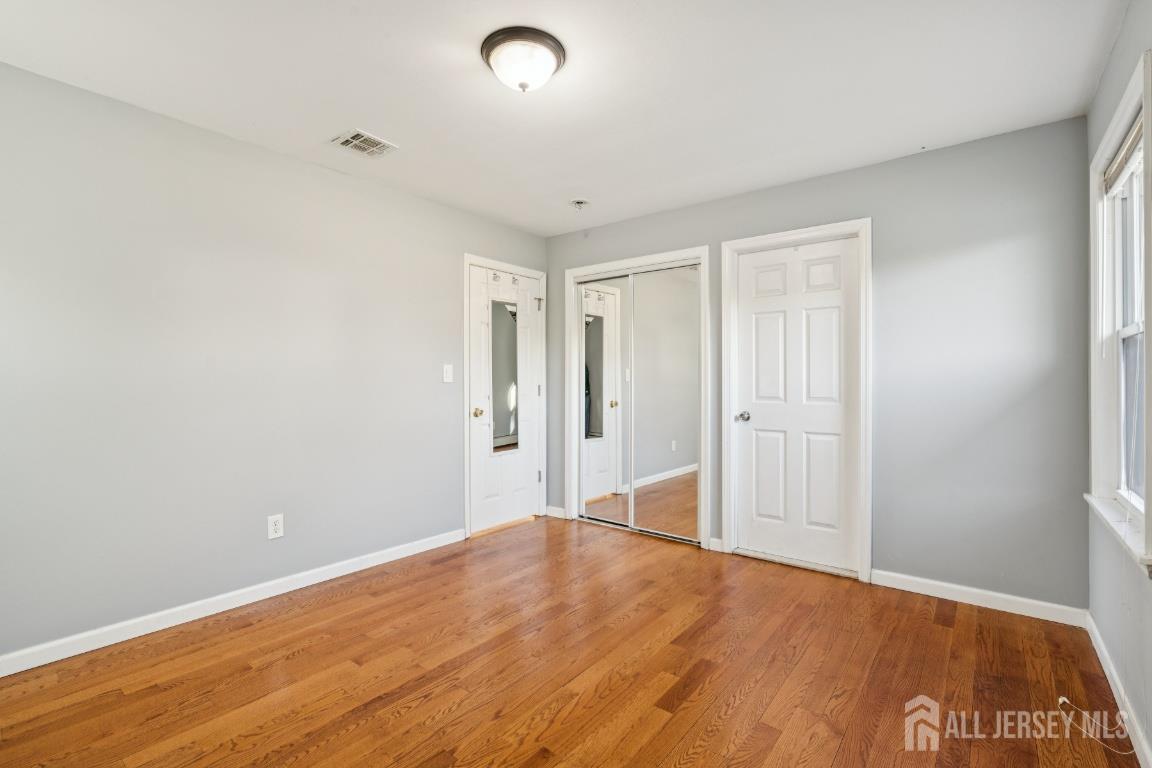 25 Reed Street Edison, NJ 08817 - Photo 15 of 23 a view of empty room with wooden floor