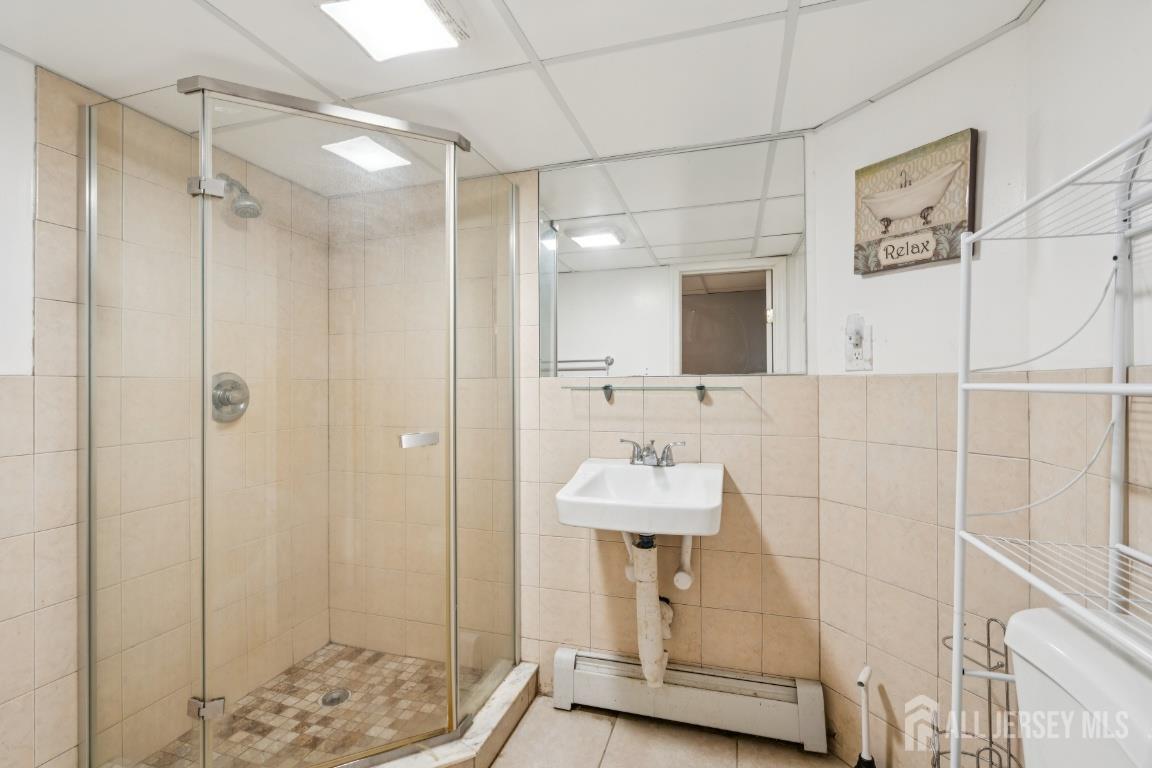 25 Reed Street Edison, NJ 08817 - Photo 20 of 23 a bathroom with a sink and a mirror