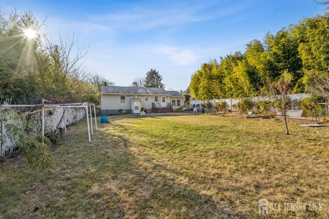 25 Reed Street Edison, NJ 08817 - Photo 23 of 23 a view of a yard with an outdoor space