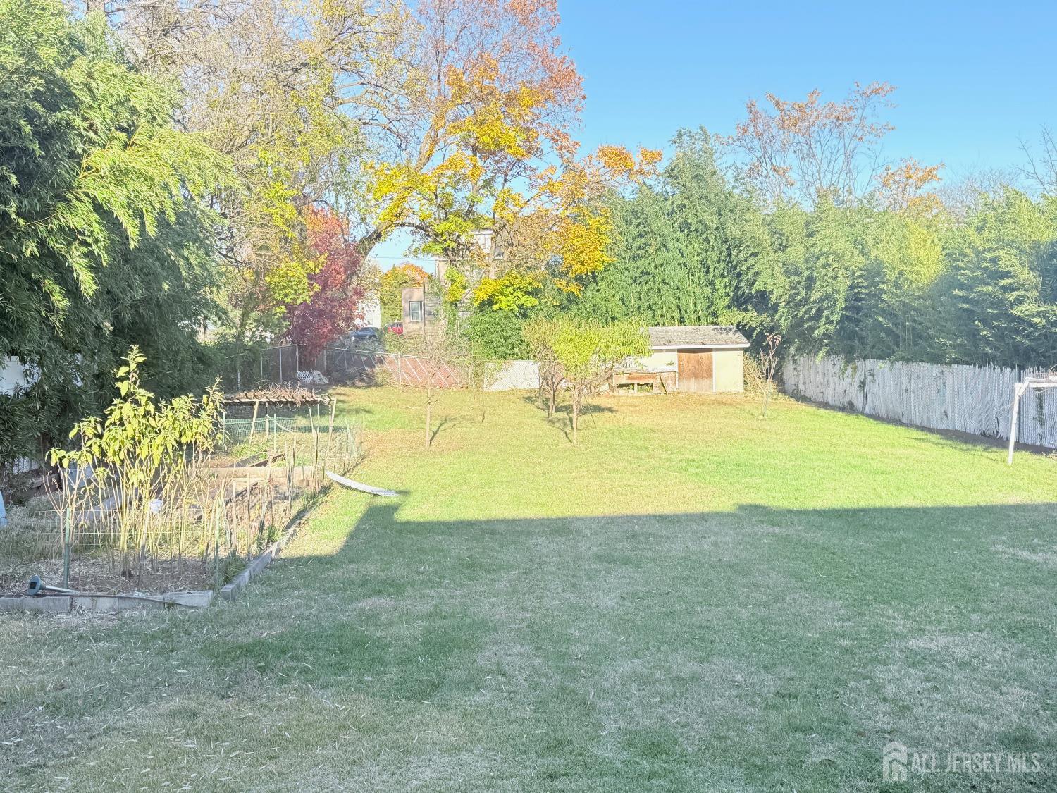 25 Reed Street Edison, NJ 08817 - Photo 3 of 3 a view of a swimming pool with an outdoor space and seating area