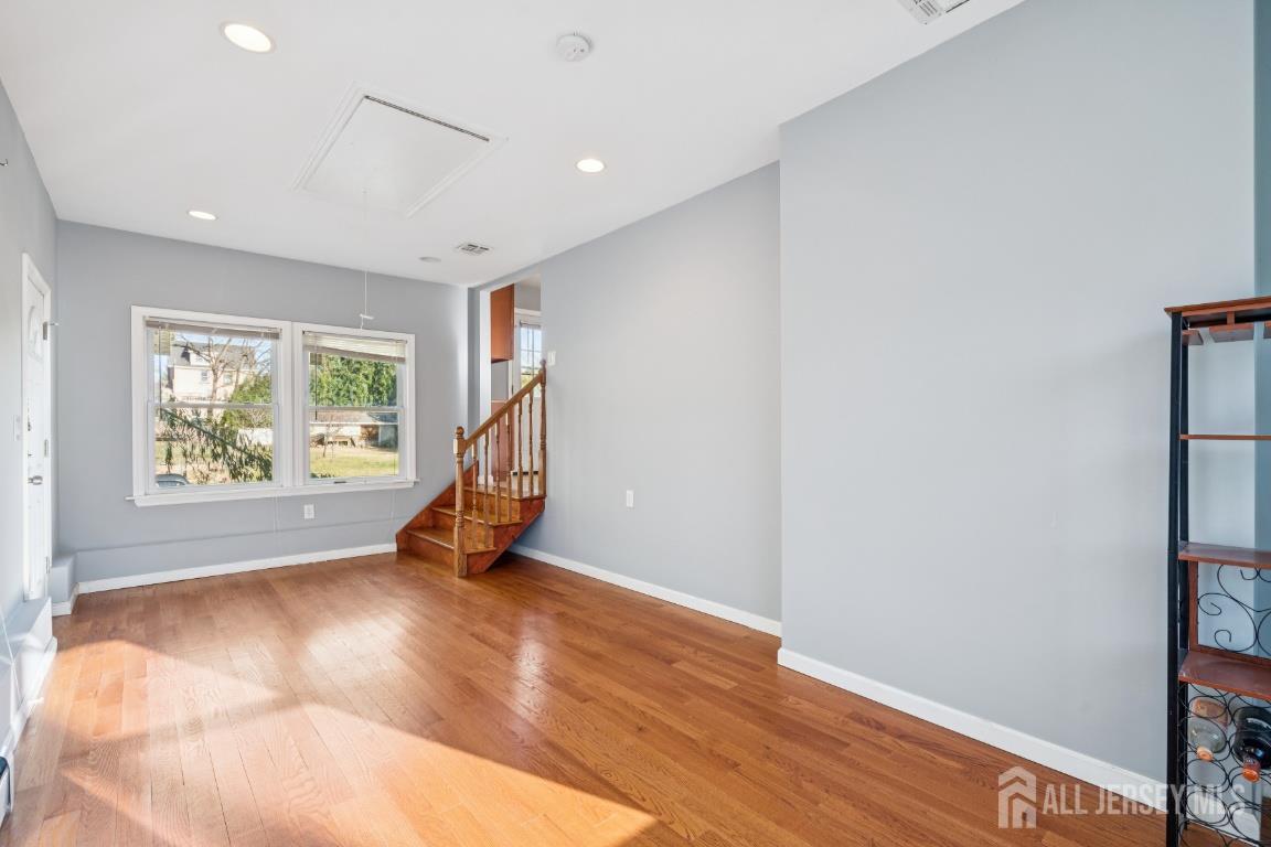 25 Reed Street Edison, NJ 08817 - Photo 7 of 23 a room with wooden floor and a window