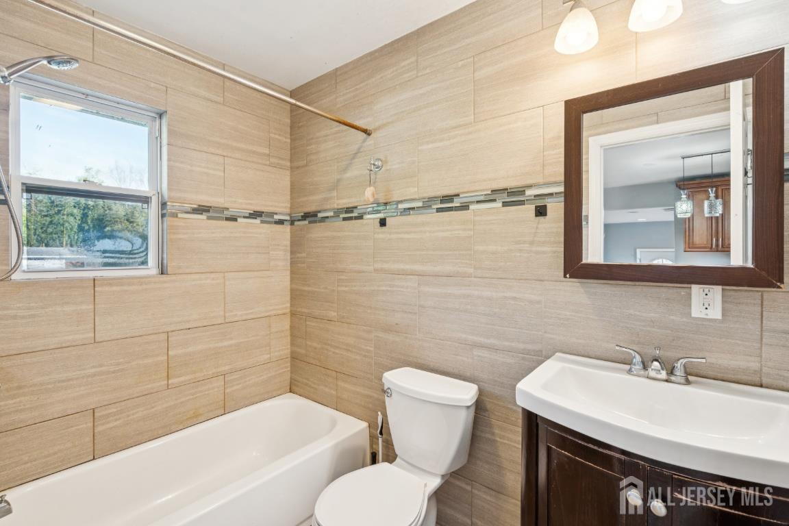 25 Reed Street Edison, NJ 08817 - Photo 8 of 23 a bathroom with a sink toilet and shower