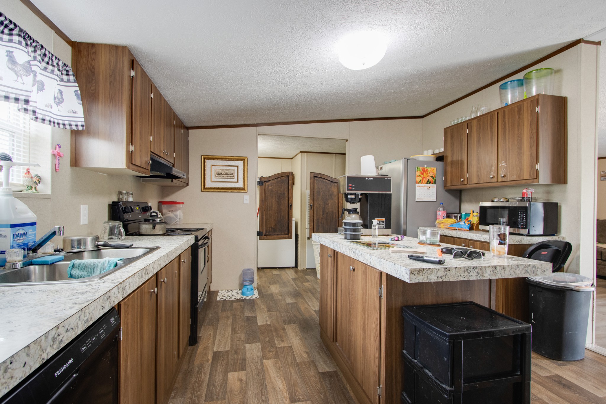 6 Spar Mine Road Lebanon, TN 37087 - Photo 12 of 30 a kitchen with stainless steel appliances granite countertop a sink stove refrigerator and cabinets