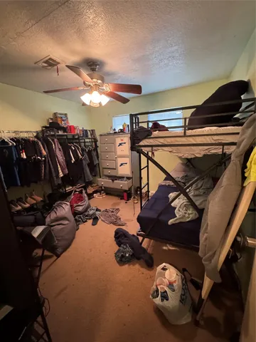 a room with patio furniture and a fireplace