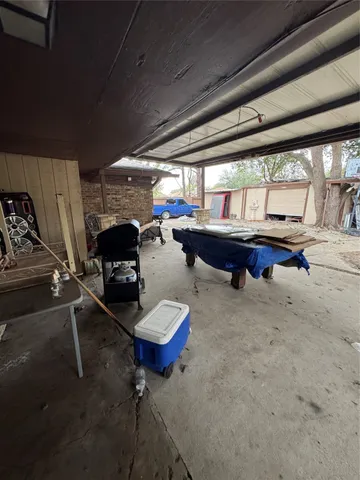 a view of backyard with wooden fence