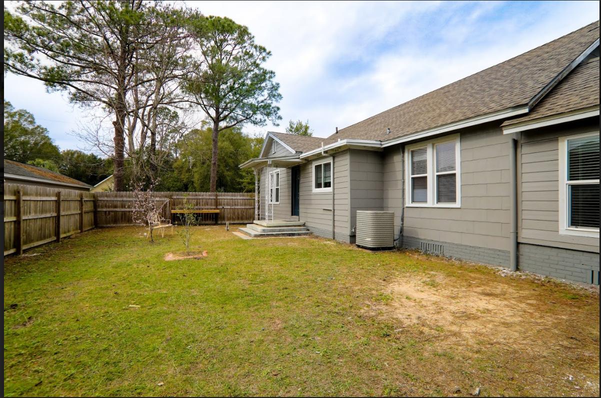 302 East 2nd Avenue Crestview, FL 32536 - Photo 12 of 12 a view of a house with pool and chairs