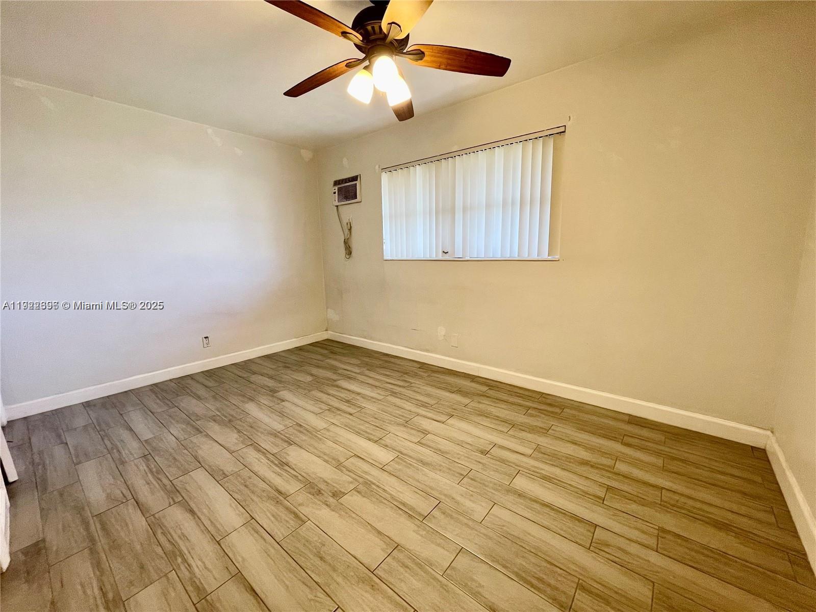 213 Southwest 10th Street Hallandale Beach, FL 33009 - Photo 4 of 8 wooden floor in an empty room