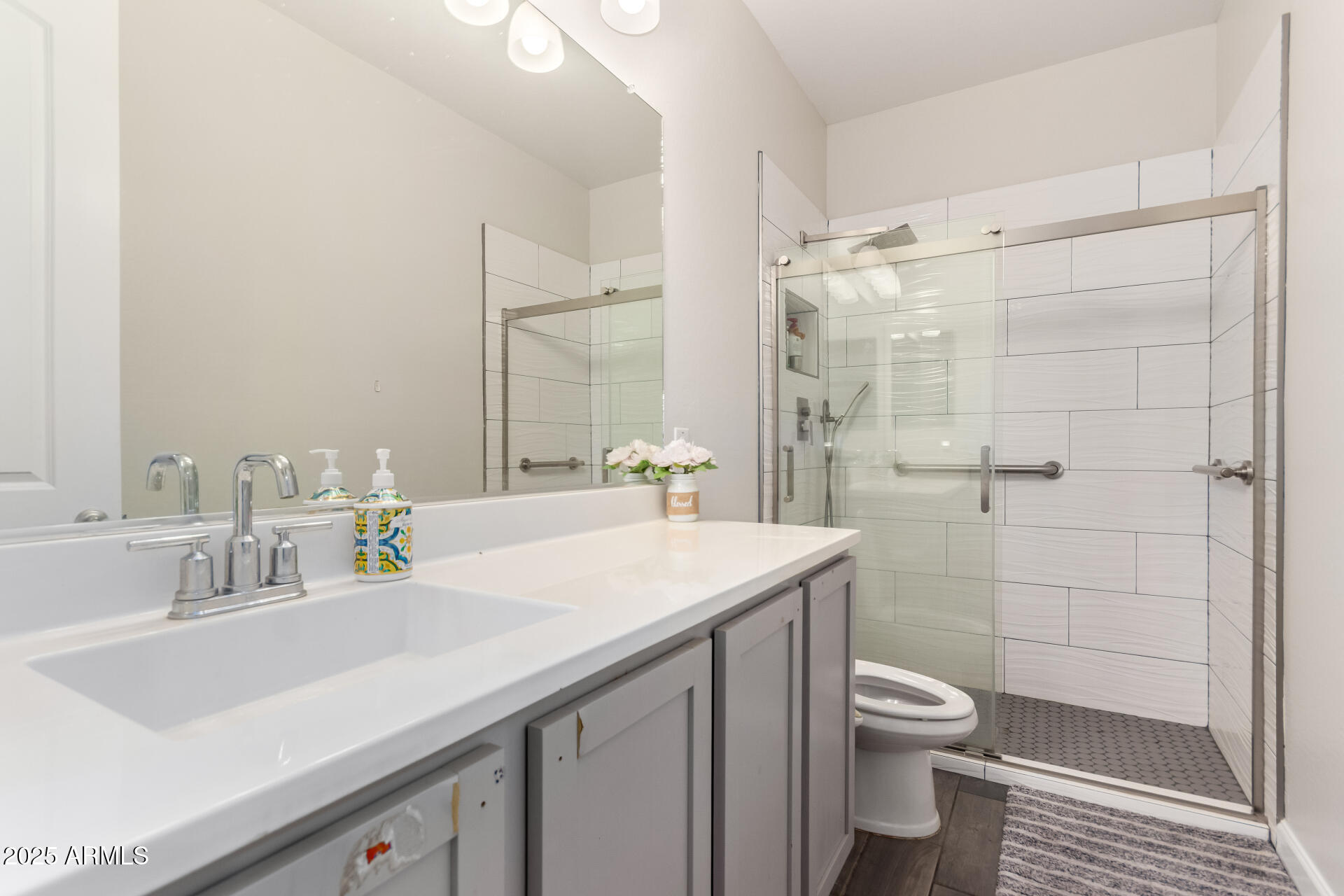 1927 West Plum Road Phoenix, AZ 85085 - Photo 12 of 17 a bathroom with a sink a toilet and shower
