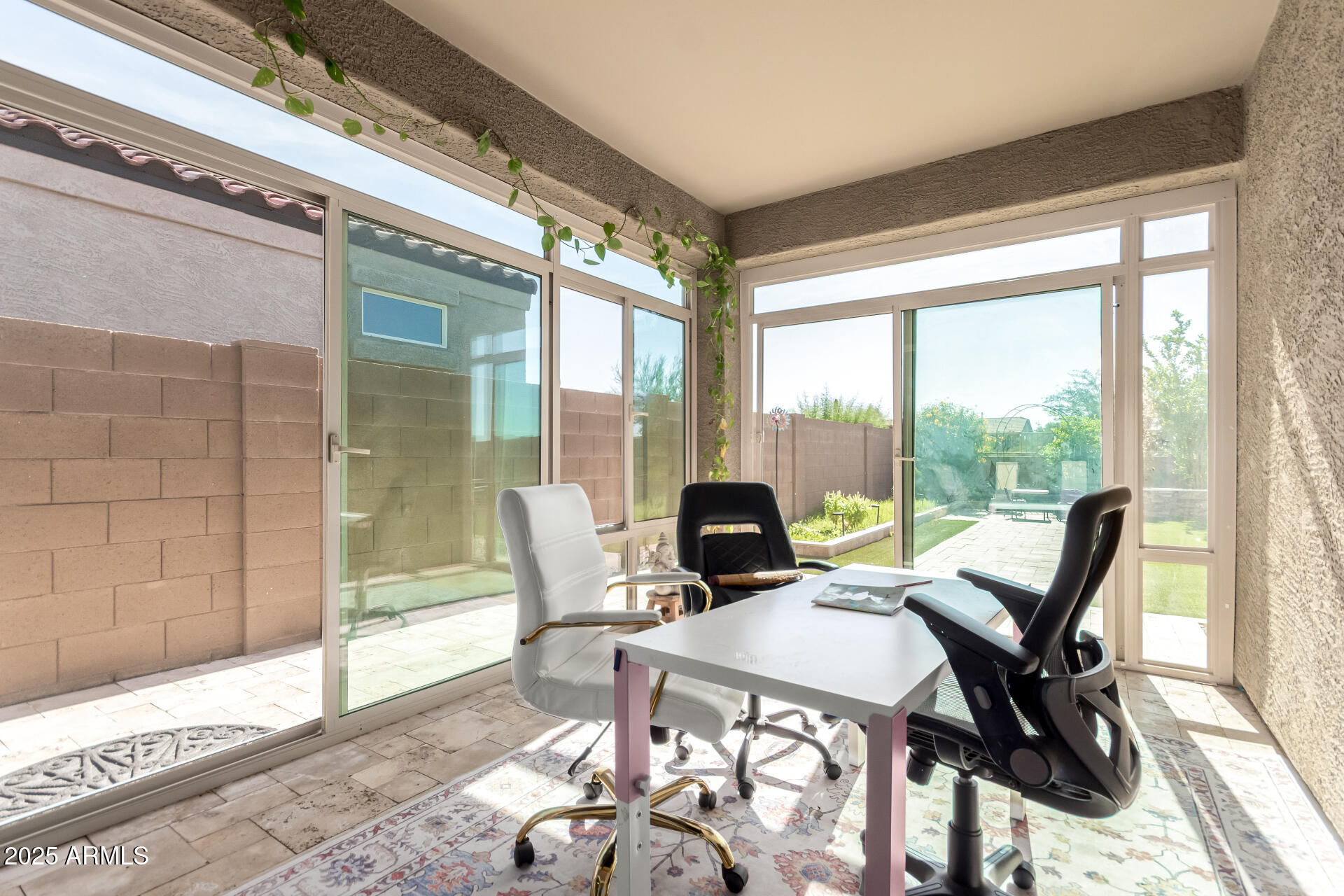 1927 West Plum Road Phoenix, AZ 85085 - Photo 14 of 17 a view of a dining room with furniture large windows and wooden floor