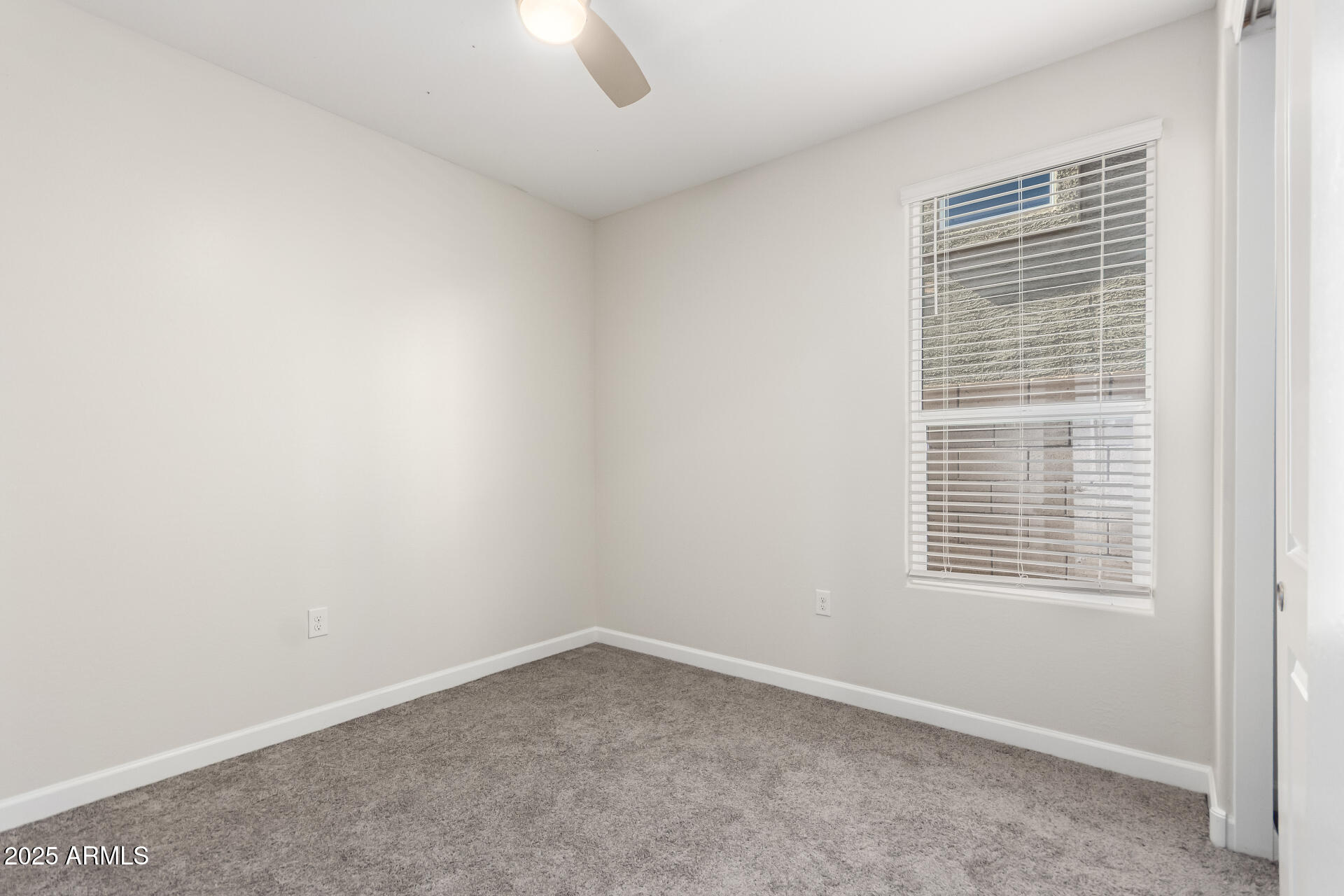 1927 West Plum Road Phoenix, AZ 85085 - Photo 10 of 17 an empty room with a window