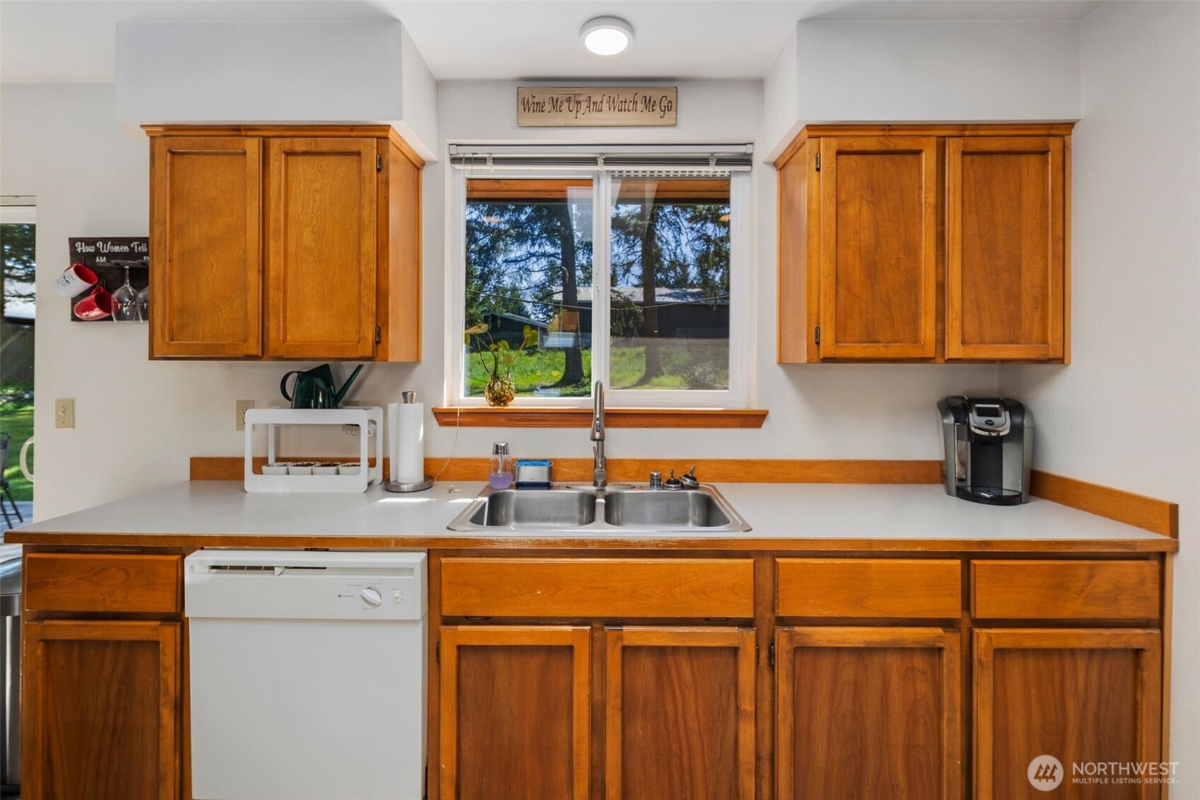 22424 South Prairie Road East Bonney Lake, WA 98391 - Photo 12 of 32 a kitchen with stainless steel appliances granite countertop a sink and a cabinets