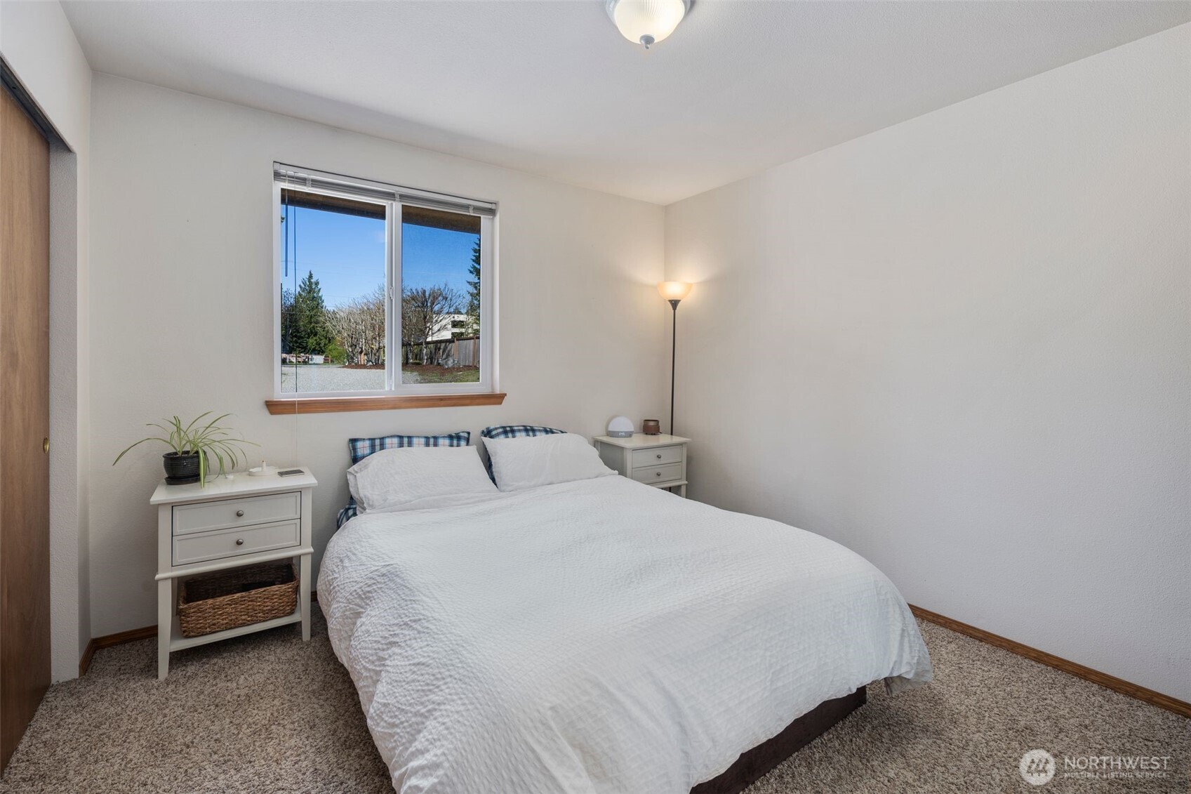 22424 South Prairie Road East Bonney Lake, WA 98391 - Photo 16 of 32 a bedroom with a bed and a window