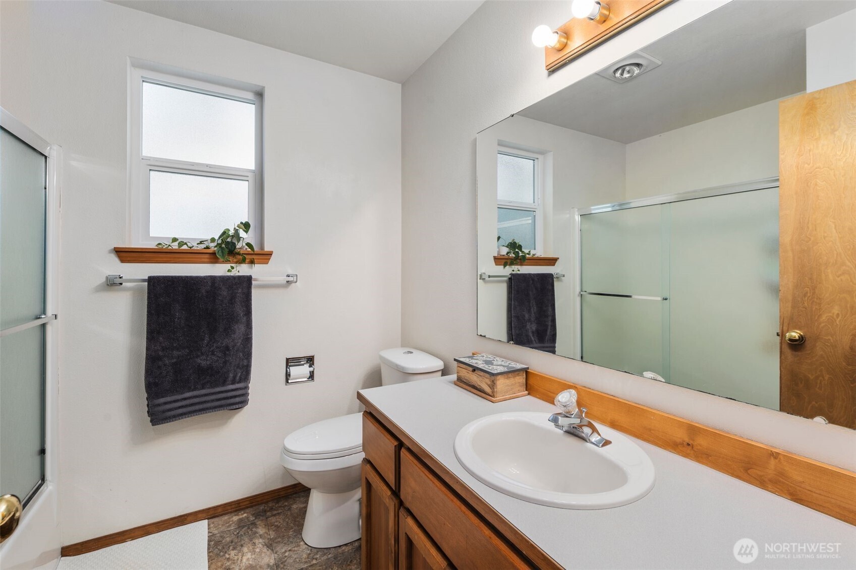 22424 South Prairie Road East Bonney Lake, WA 98391 - Photo 18 of 32 a bathroom with a sink toilet and shower