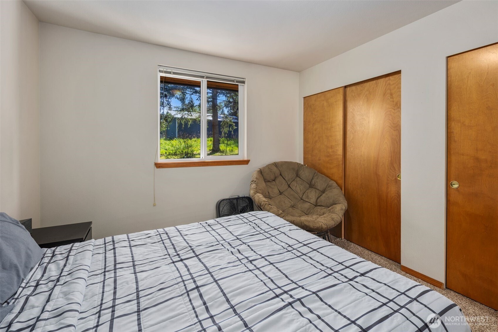 22424 South Prairie Road East Bonney Lake, WA 98391 - Photo 21 of 32 a bedroom with a bed and a window