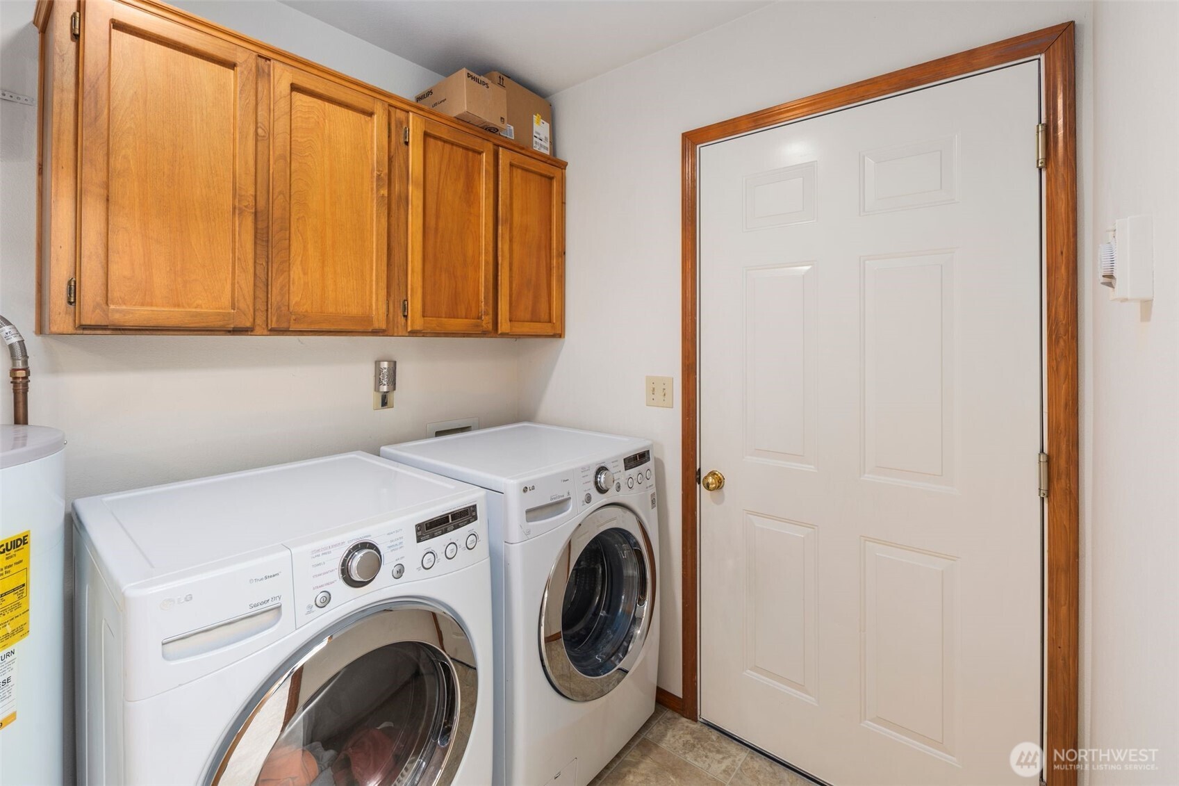 22424 South Prairie Road East Bonney Lake, WA 98391 - Photo 23 of 32 a view of storage and utility room with washer and dryer