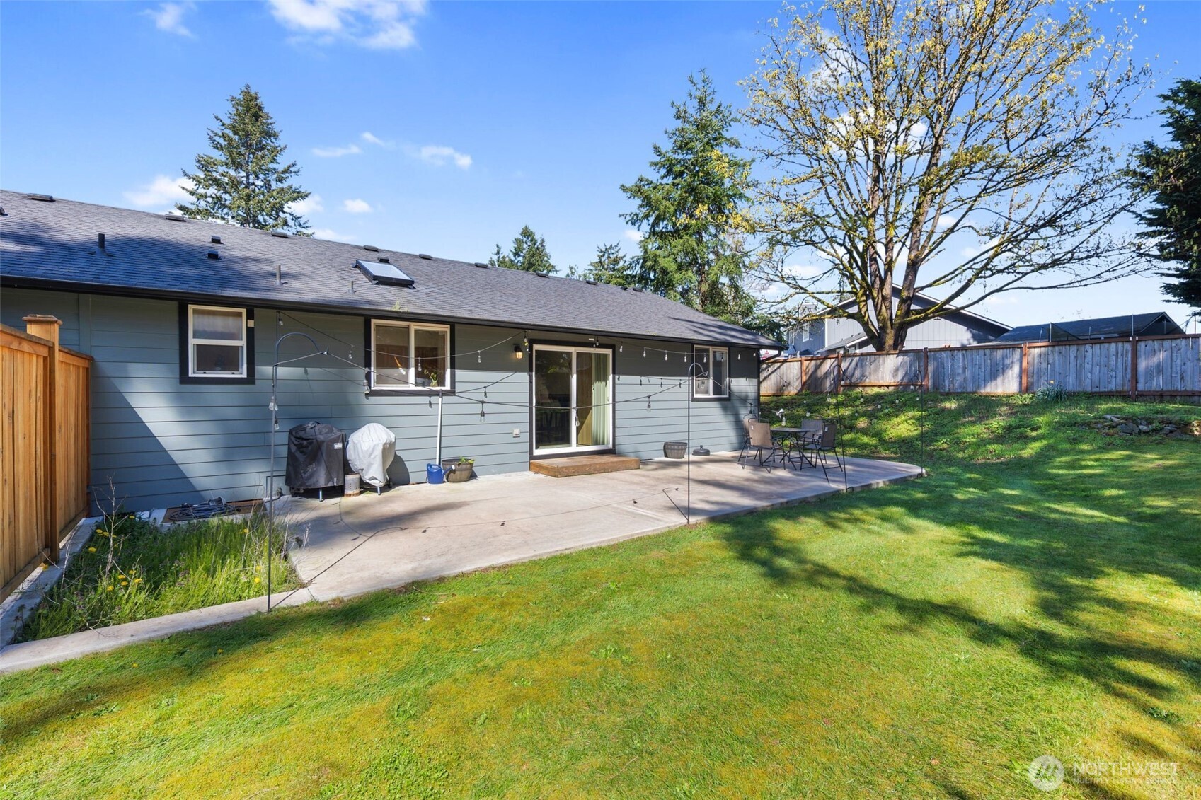 22424 South Prairie Road East Bonney Lake, WA 98391 - Photo 25 of 32 a front view of a house with a yard patio and swimming pool