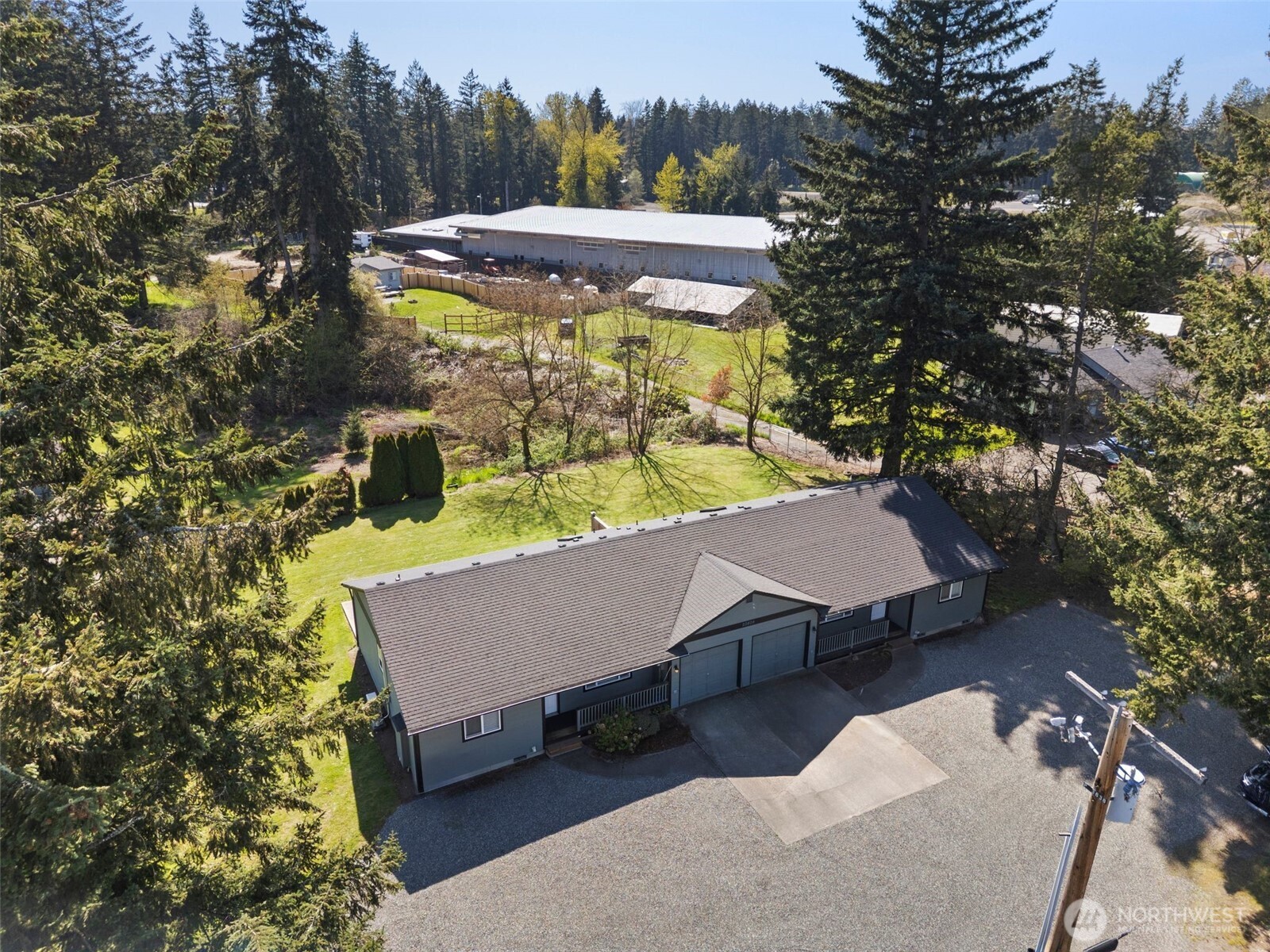 22424 South Prairie Road East Bonney Lake, WA 98391 - Photo 31 of 32 an aerial view of a house with swimming pool and patio
