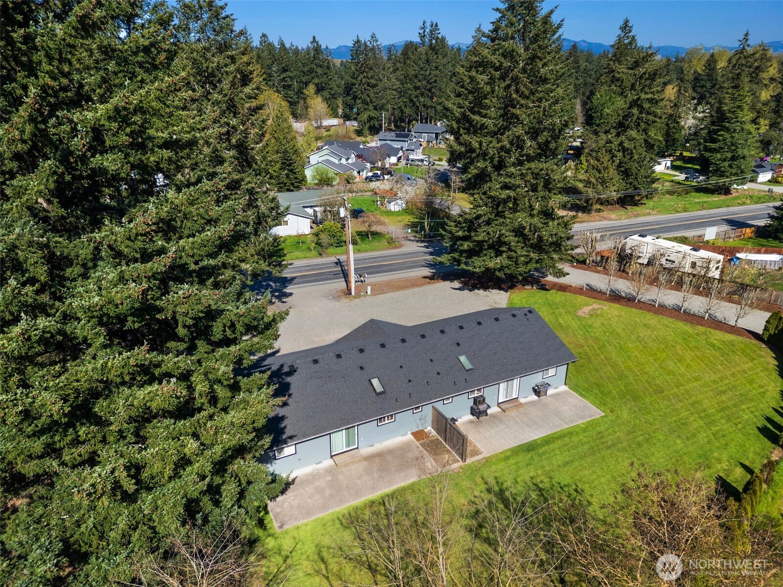 22424 South Prairie Road East Bonney Lake, WA 98391 - Photo 32 of 32 an aerial view of a house with a yard