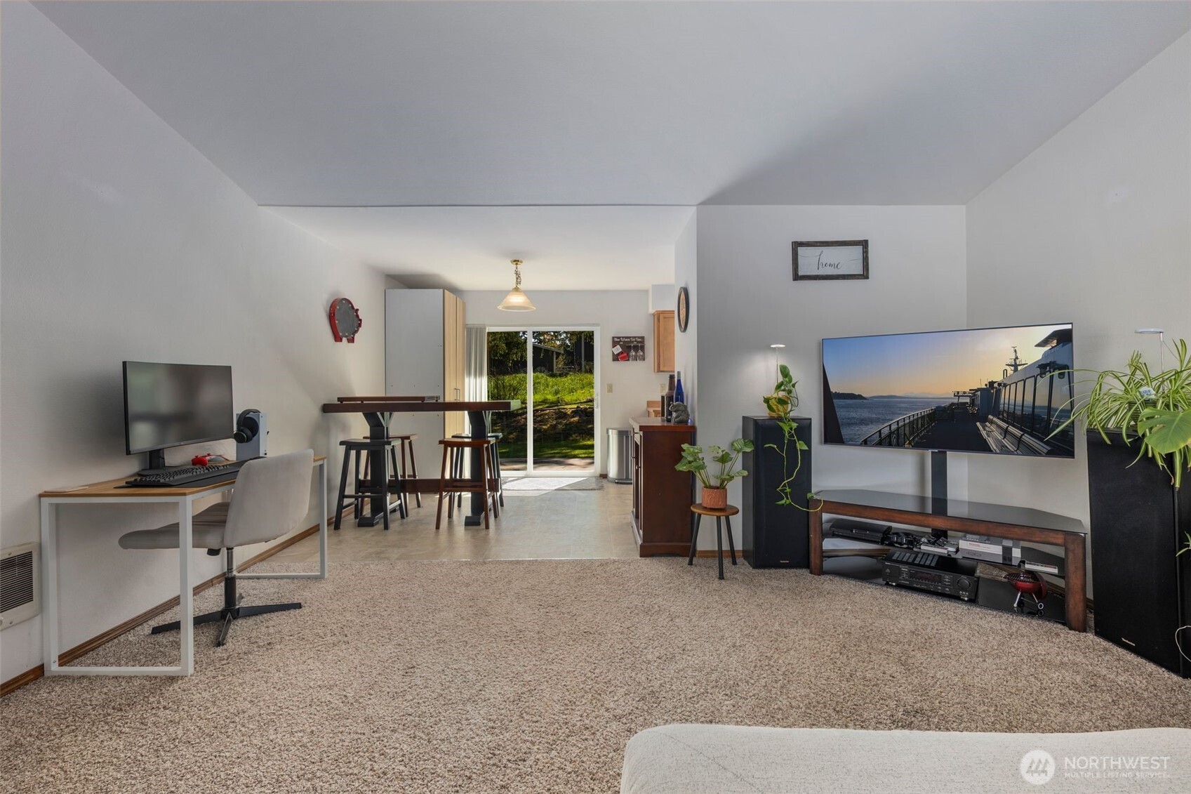 22424 South Prairie Road East Bonney Lake, WA 98391 - Photo 4 of 32 a living room with furniture and a flat screen tv