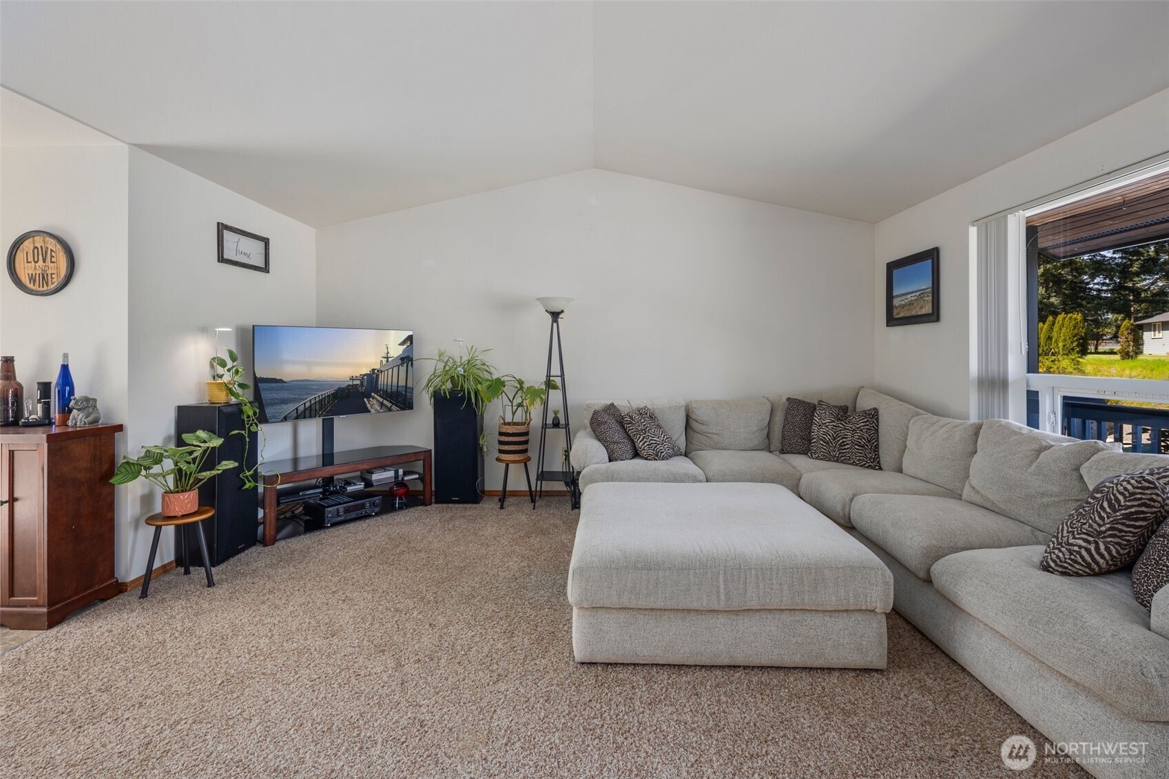 22424 South Prairie Road East Bonney Lake, WA 98391 - Photo 6 of 32 a living room with furniture and a flat screen tv
