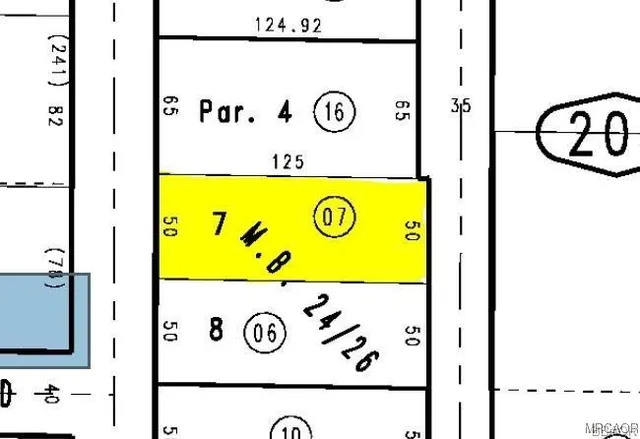 a view of a yard from a lake