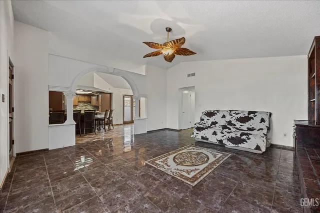 a living room with furniture and a rug