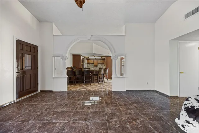 a view of a livingroom with furniture and chandelier