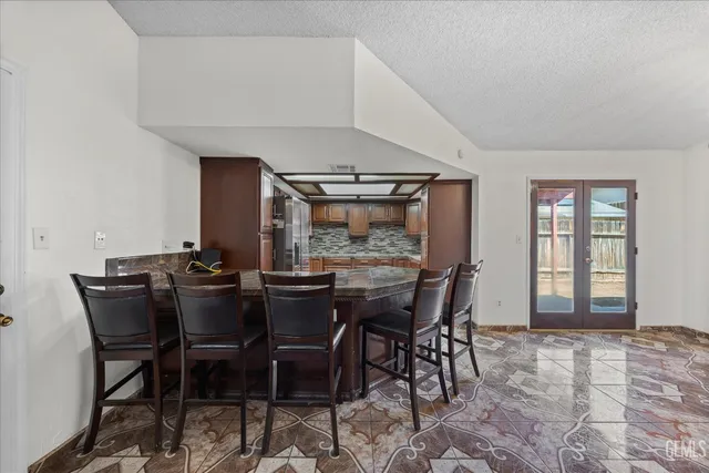 a view of a dining room with furniture and window