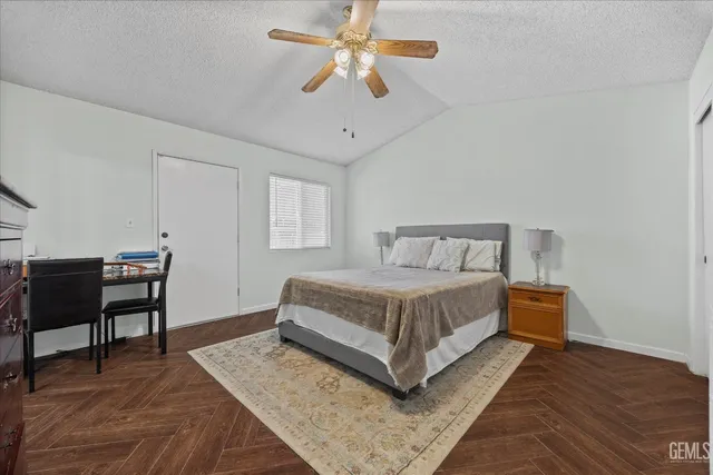 a bedroom with a bed and a desk