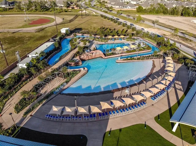a view of a swimming pool with outdoor seating