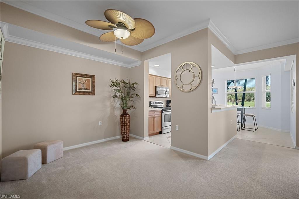 10285 Heritage Bay Boulevard, Unit 817 Naples, FL 34120 - Photo 12 of 42 a view of room with furniture and a fan