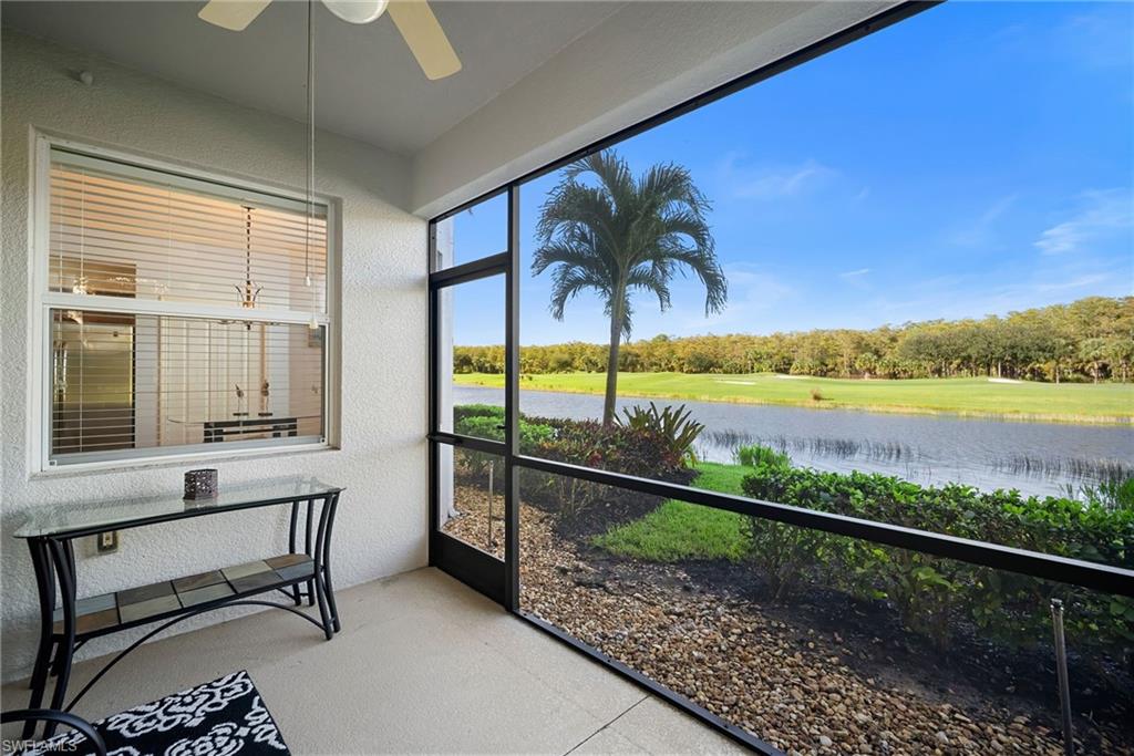 10285 Heritage Bay Boulevard, Unit 817 Naples, FL 34120 - Photo 30 of 42 a view of a chairs and table in patio