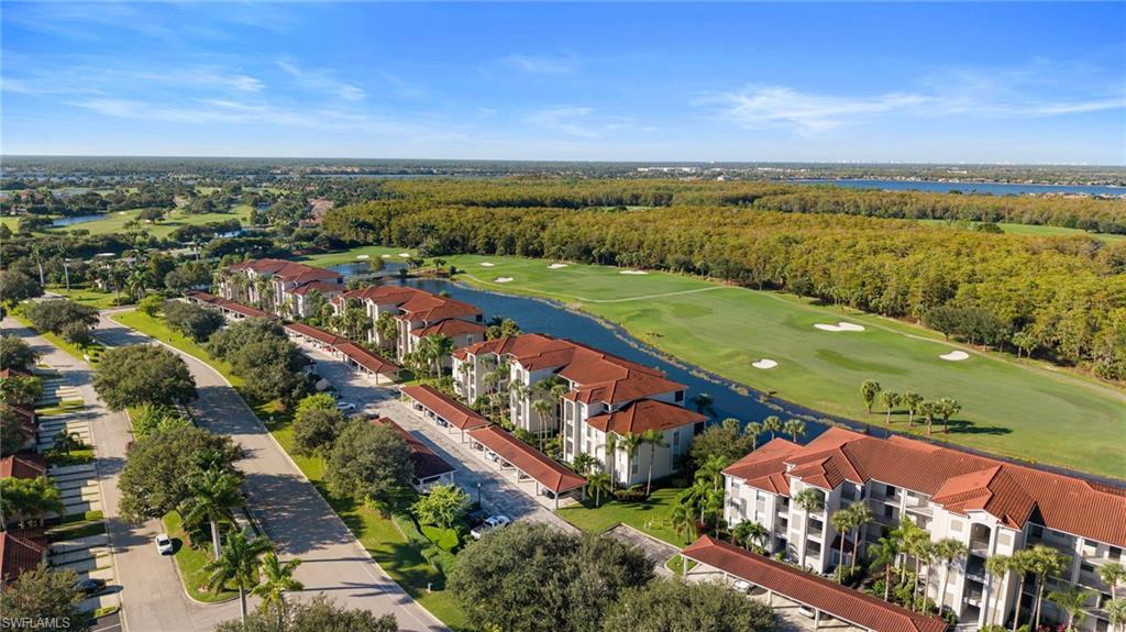 10285 Heritage Bay Boulevard, Unit 817 Naples, FL 34120 - Photo 35 of 42 an aerial view of a city