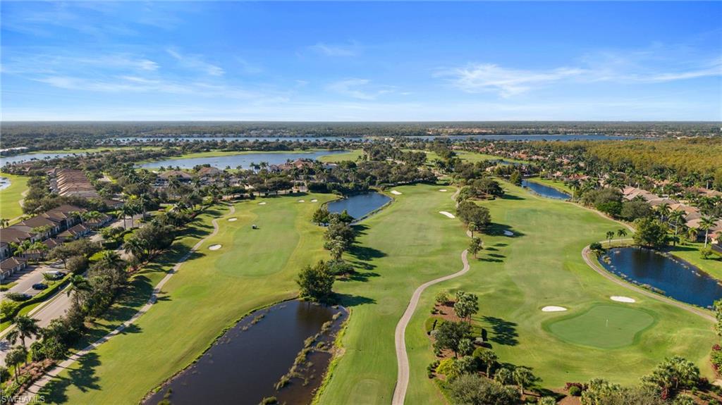 10285 Heritage Bay Boulevard, Unit 817 Naples, FL 34120 - Photo 41 of 42 an aerial view of a residential houses with outdoor space