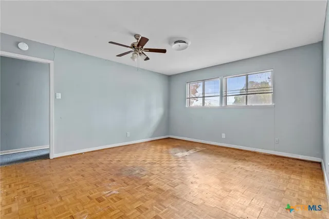 a view of an empty room with a window