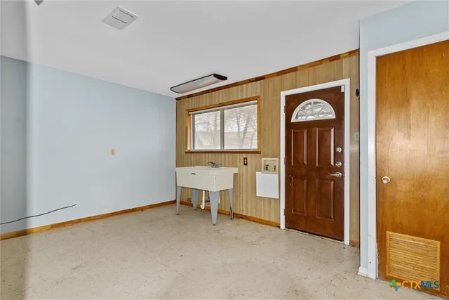 a view of entryway with wooden floor