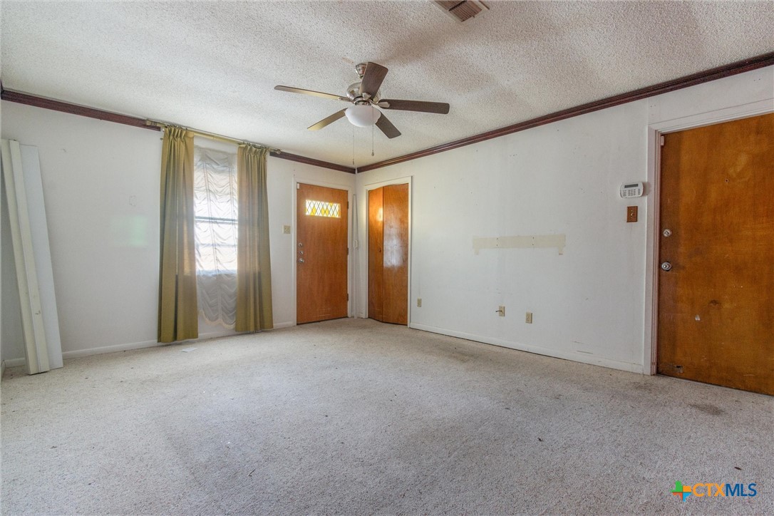 1101 Ridgeway Drive Killeen, TX 76549 - Photo 26 of 31 an empty room with ceiling fan and windows