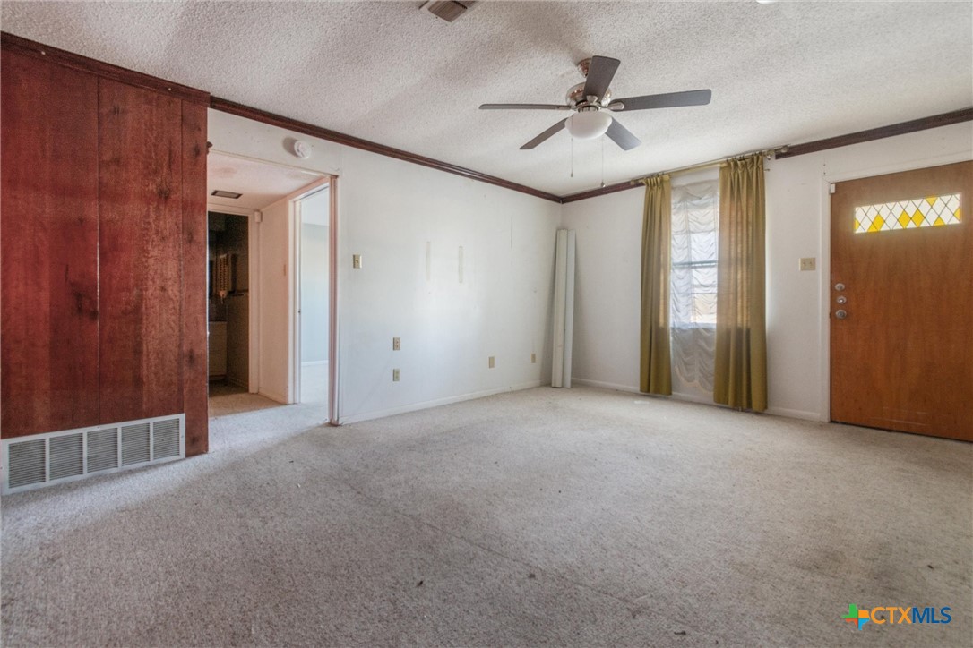 1101 Ridgeway Drive Killeen, TX 76549 - Photo 27 of 31 an empty room with ceiling fan and windows