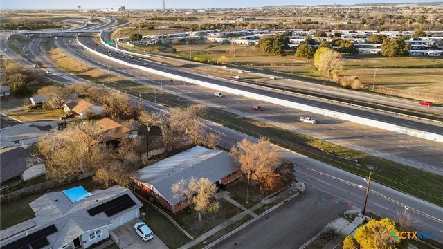 an aerial view of residential houses with outdoor space