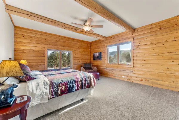 a bedroom with a bed and window